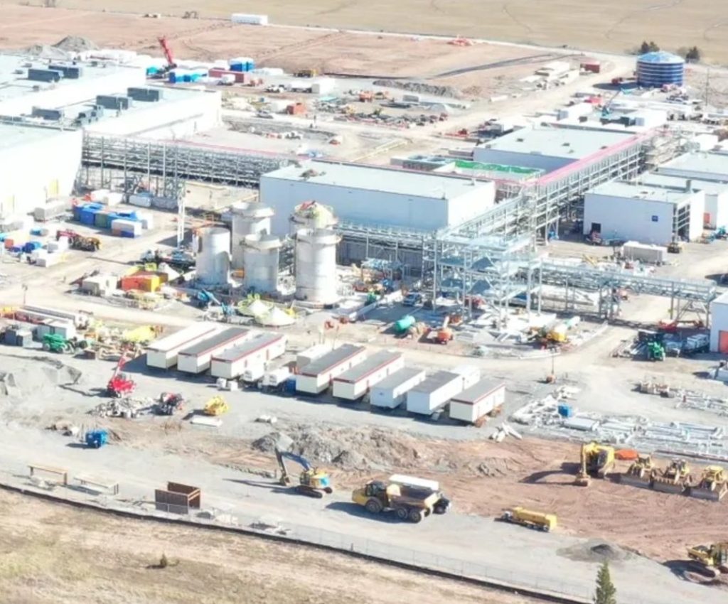Aerial view of an industrial plant with pipe racks and process equipment